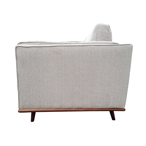 Beige fabric 3-seat sofa rear view with padded back and tapered wooden legs