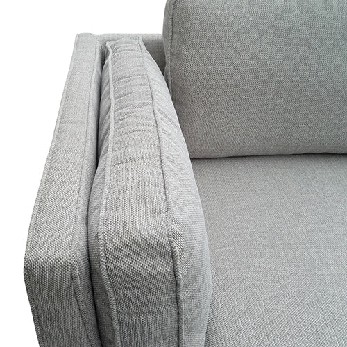 Beige fabric sofa arm and cushion detail with textured weave
