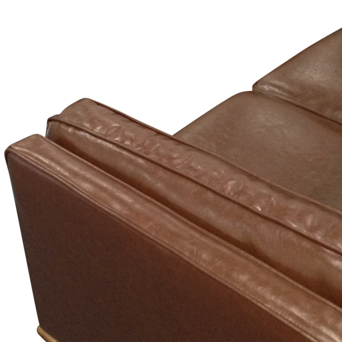 Brown faux leather sofa backrest with segmented panels and stitched top trim