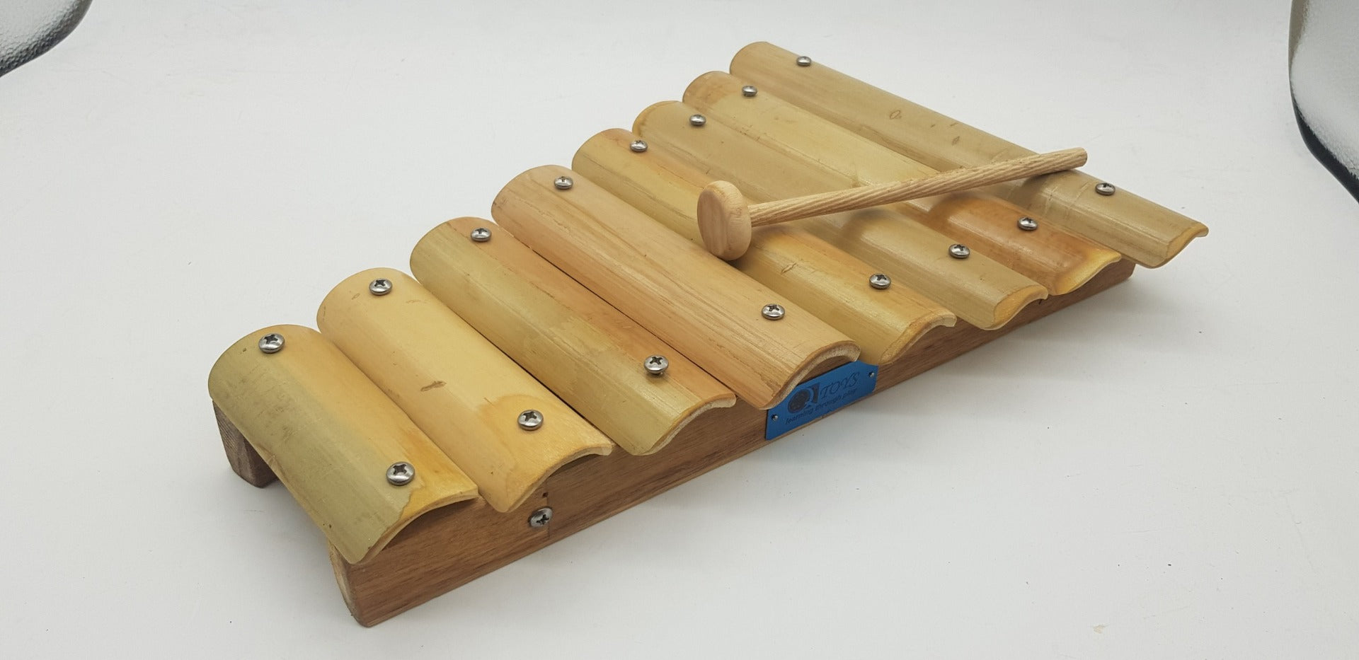 Bamboo xylophone with wooden mallet and metal-tuned bars