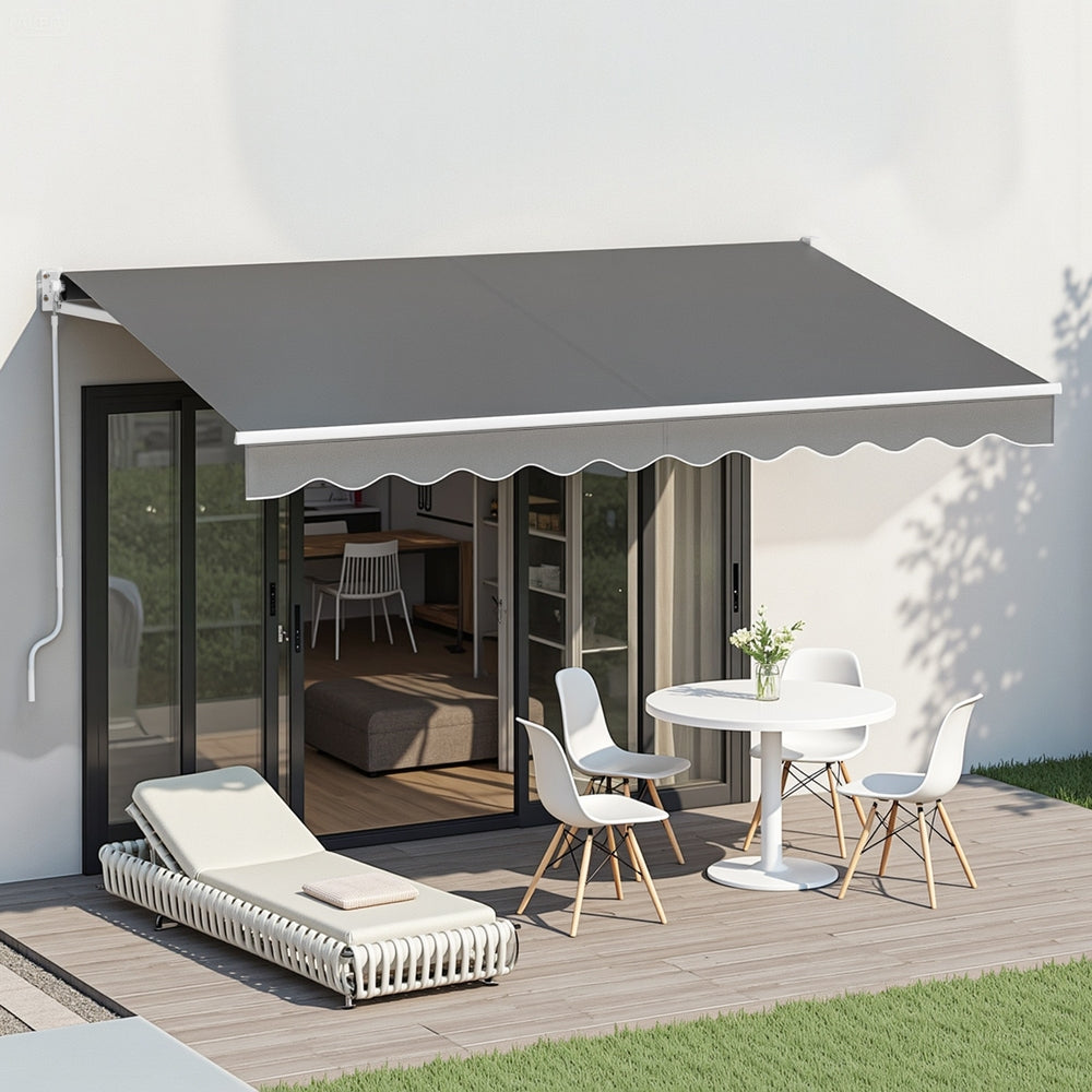 Grey retractable folding arm awning mounted above outdoor seating