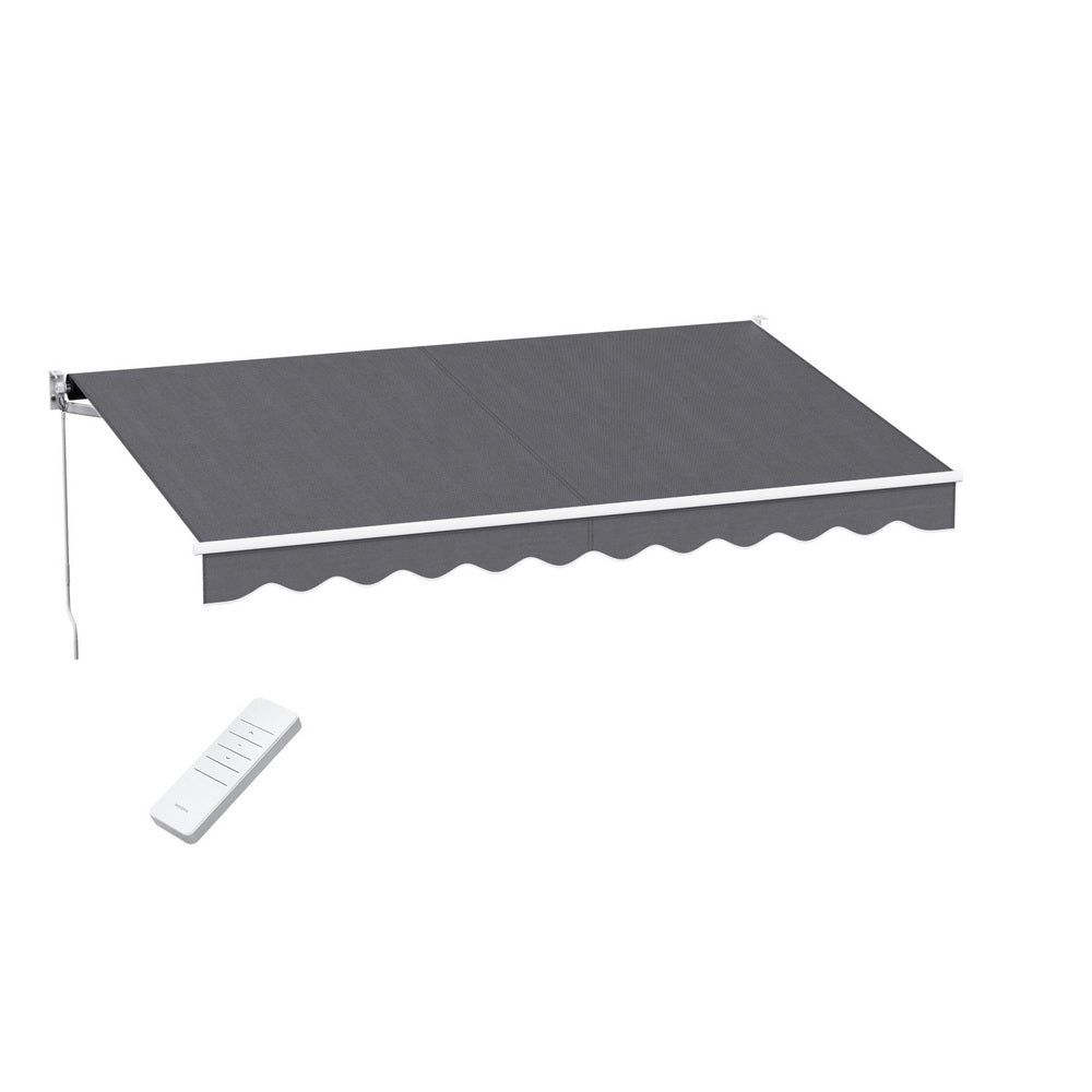Grey motorized retractable arm awning with scalloped valance and remote control