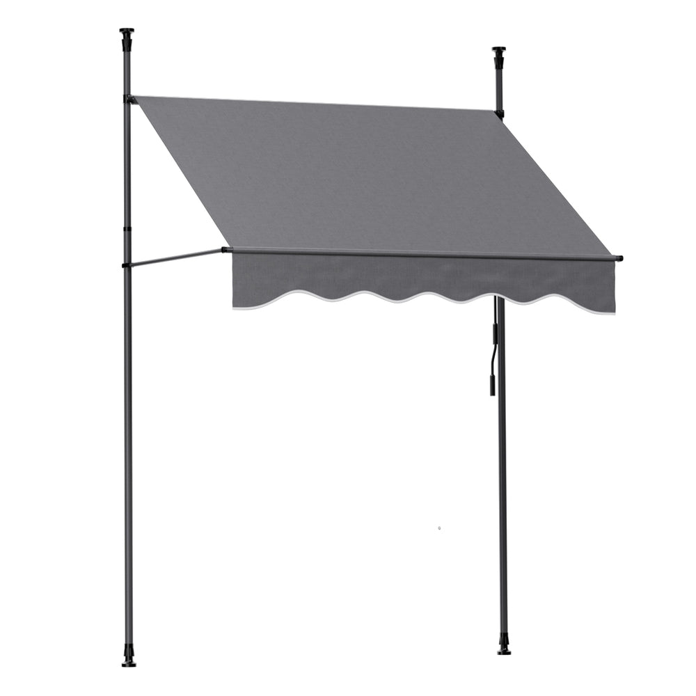 Grey fixed pivot arm door canopy awning with scalloped valance and steel frame