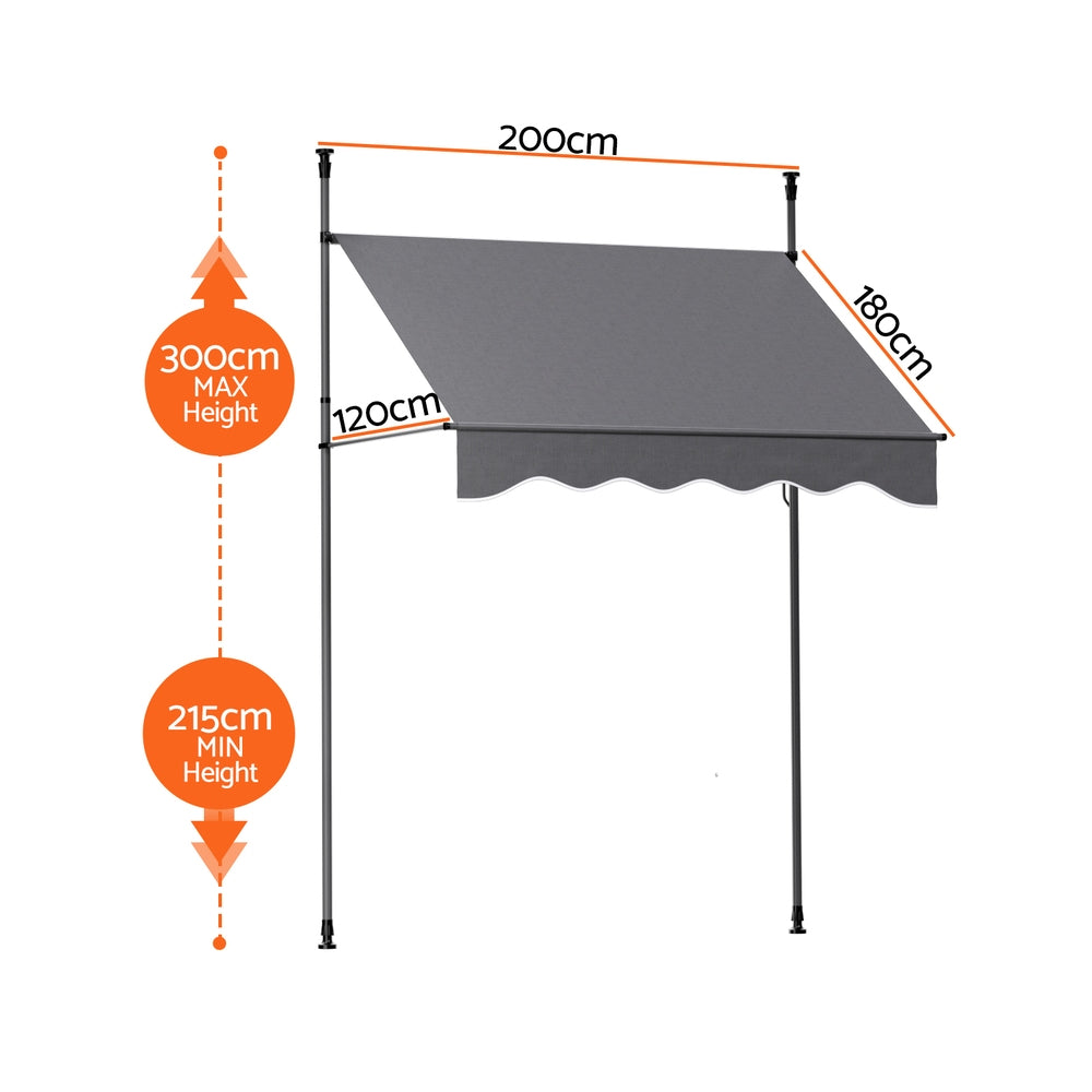 Grey pivot arm door canopy awning with adjustable-height poles and scalloped valance