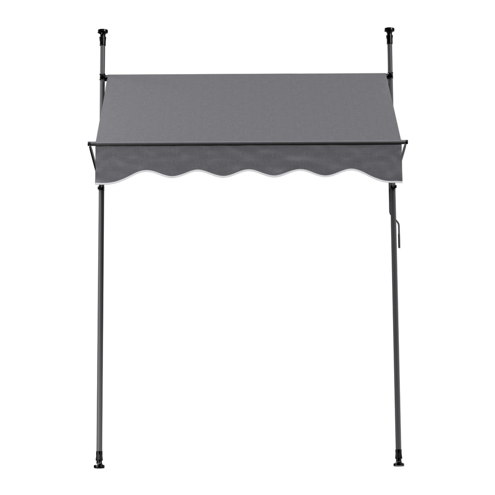 Grey door canopy awning with scalloped valance and two vertical support poles