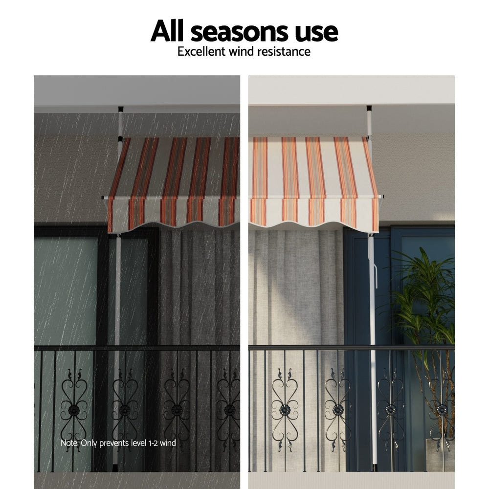 Outdoor awning with striped canopy and scalloped valance, shown in weather view