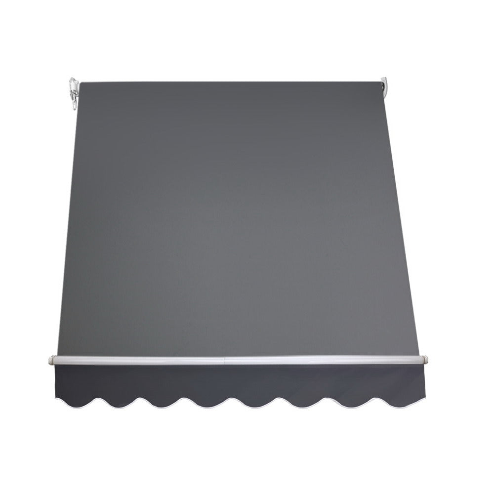 Outdoor window awning canopy with dark gray fabric and scalloped front edge