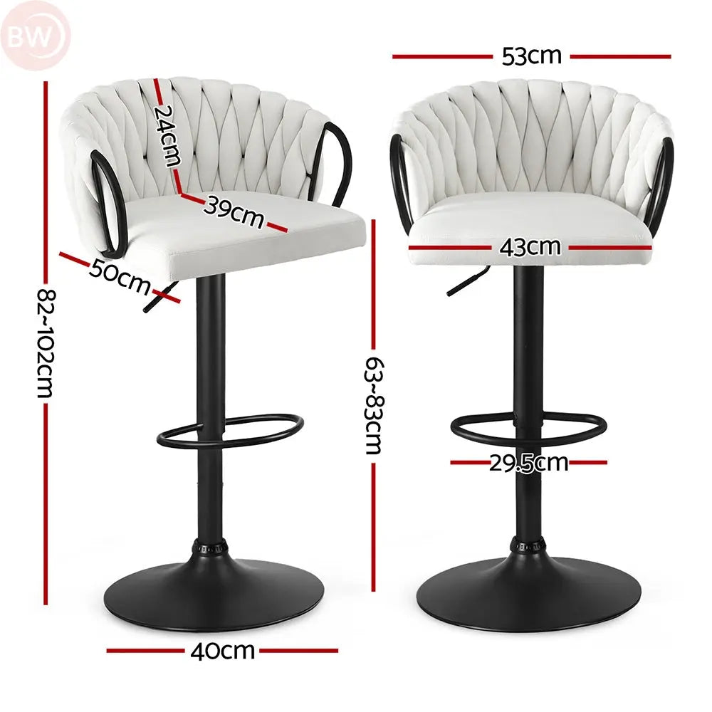 Ivory tufted velvet bar stool with black gas lift, loop arms, and round ring footrest