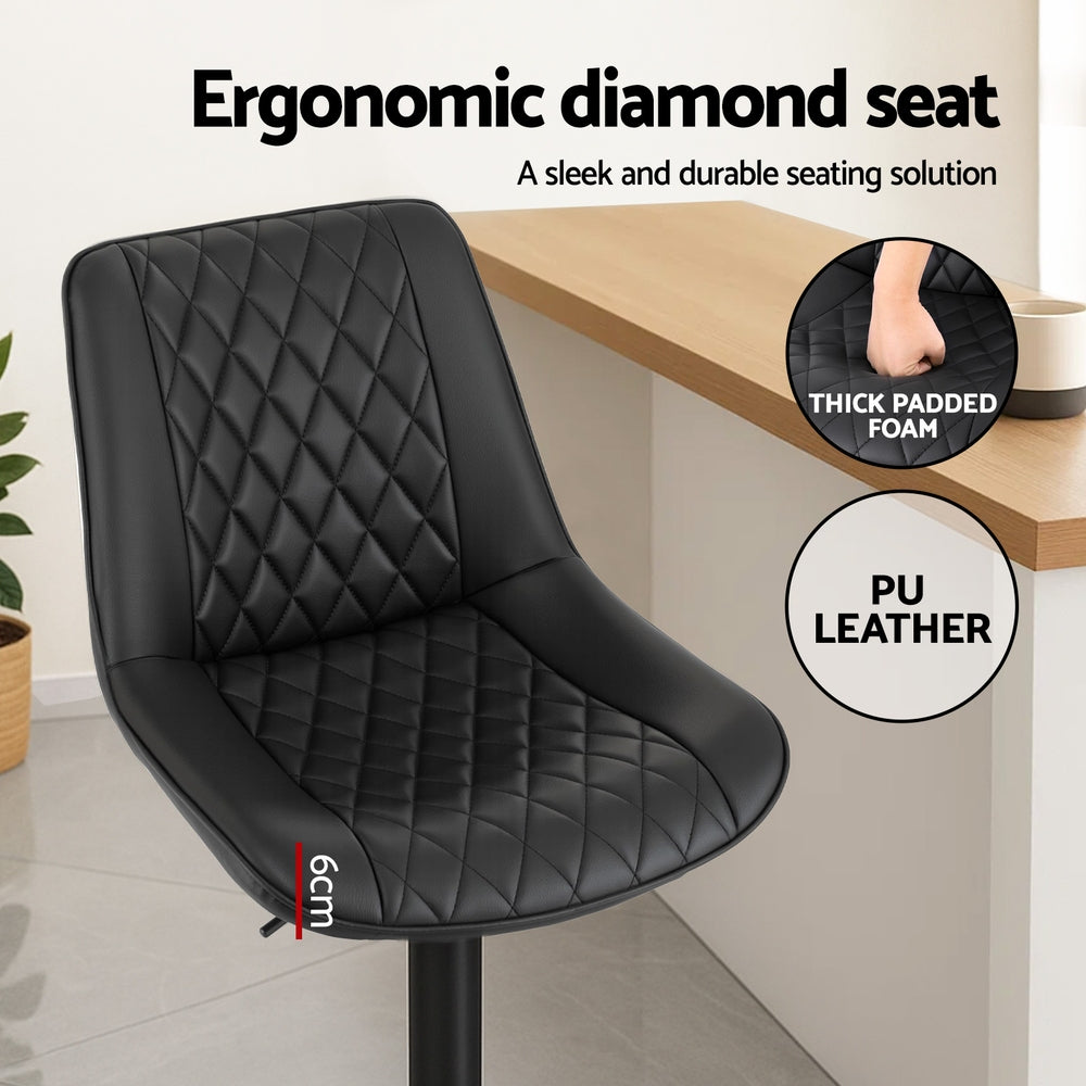 Black diamond-pattern padded bar stool seat with thick cushioning and curved back