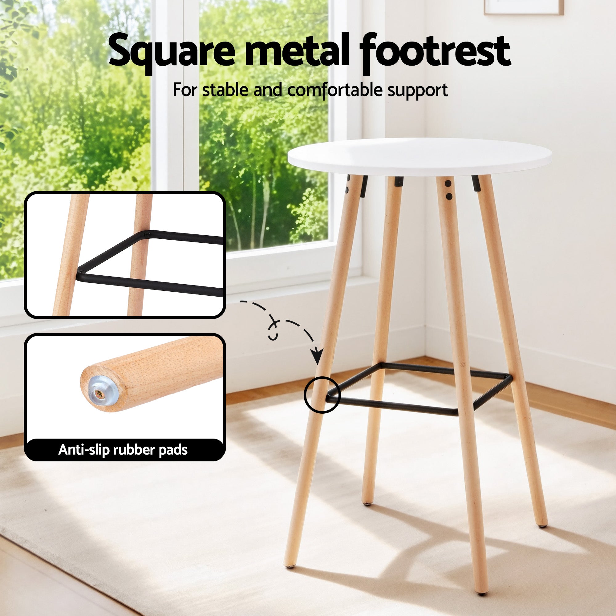 Round bar table with white top, light wood legs, and black metal square footrest