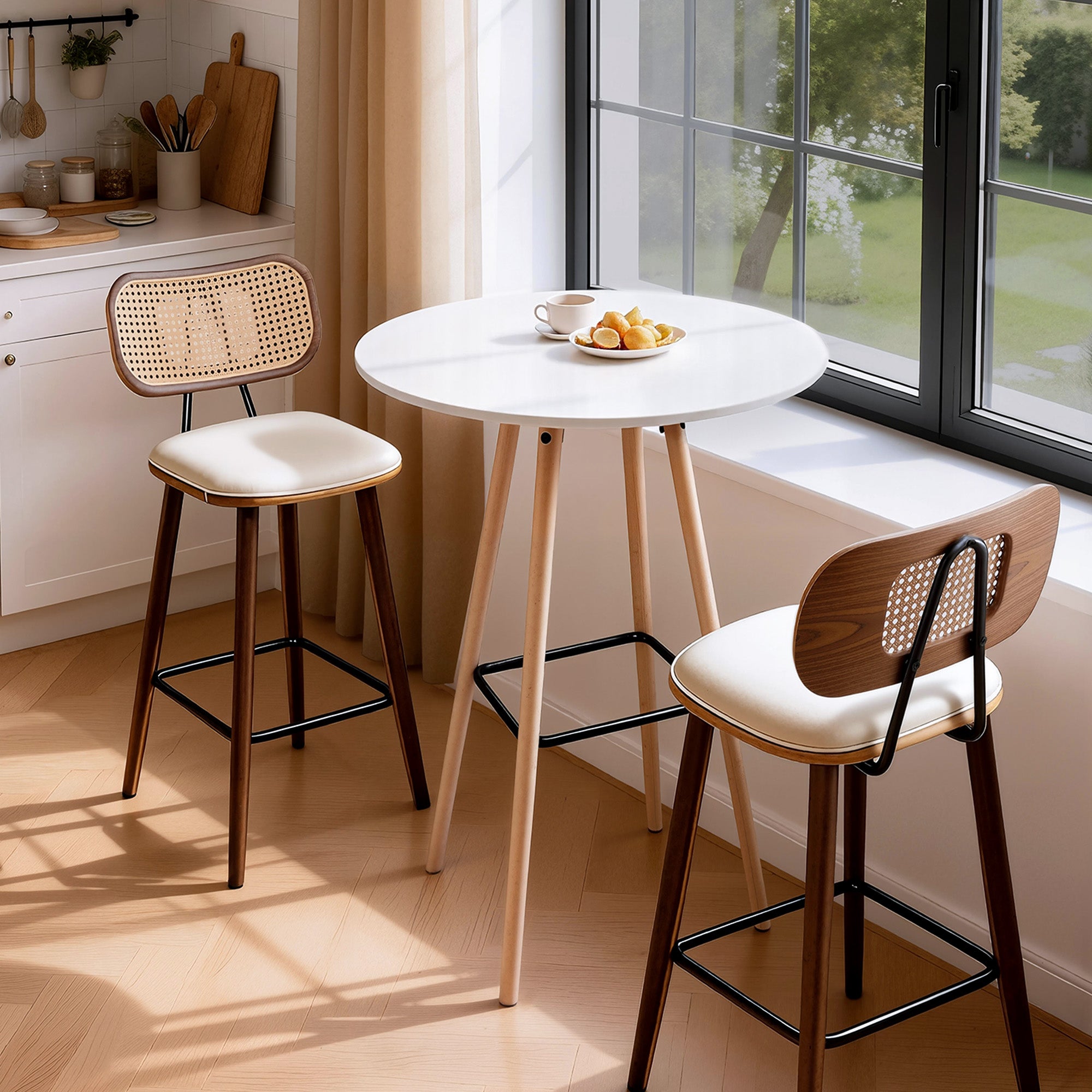Round white bar table with light wood legs and black metal footrest beside window
