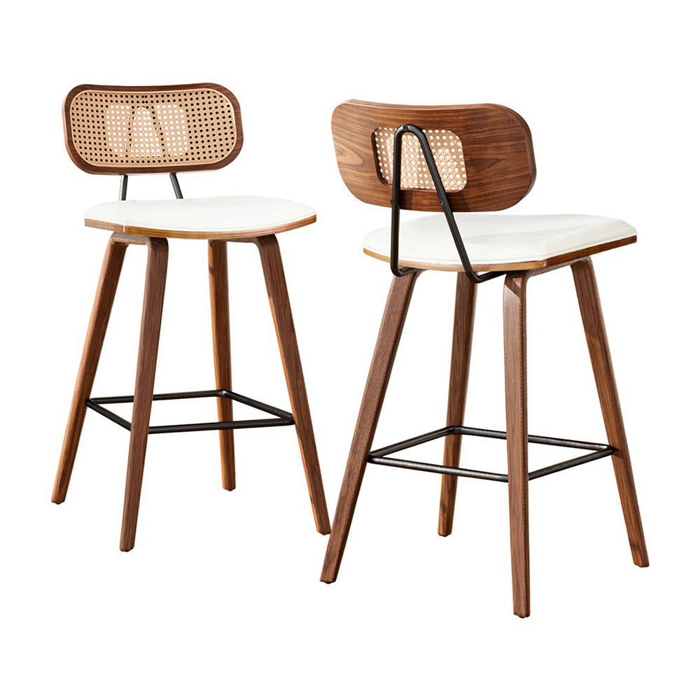 Rattan back bar stool with white padded seat, wooden legs and black metal footrest