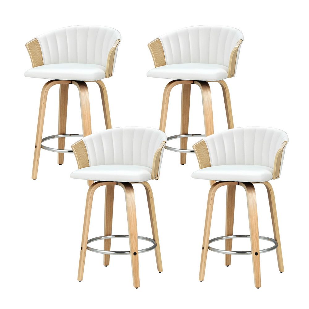 Set of four white padded swivel bar stools with light wooden legs and chrome footrest.