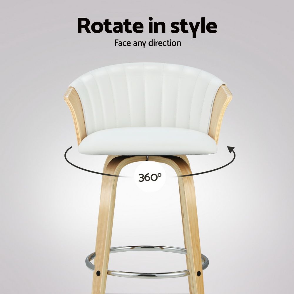 White padded swivel bar stool with vertical ribbed back and chrome footrest.