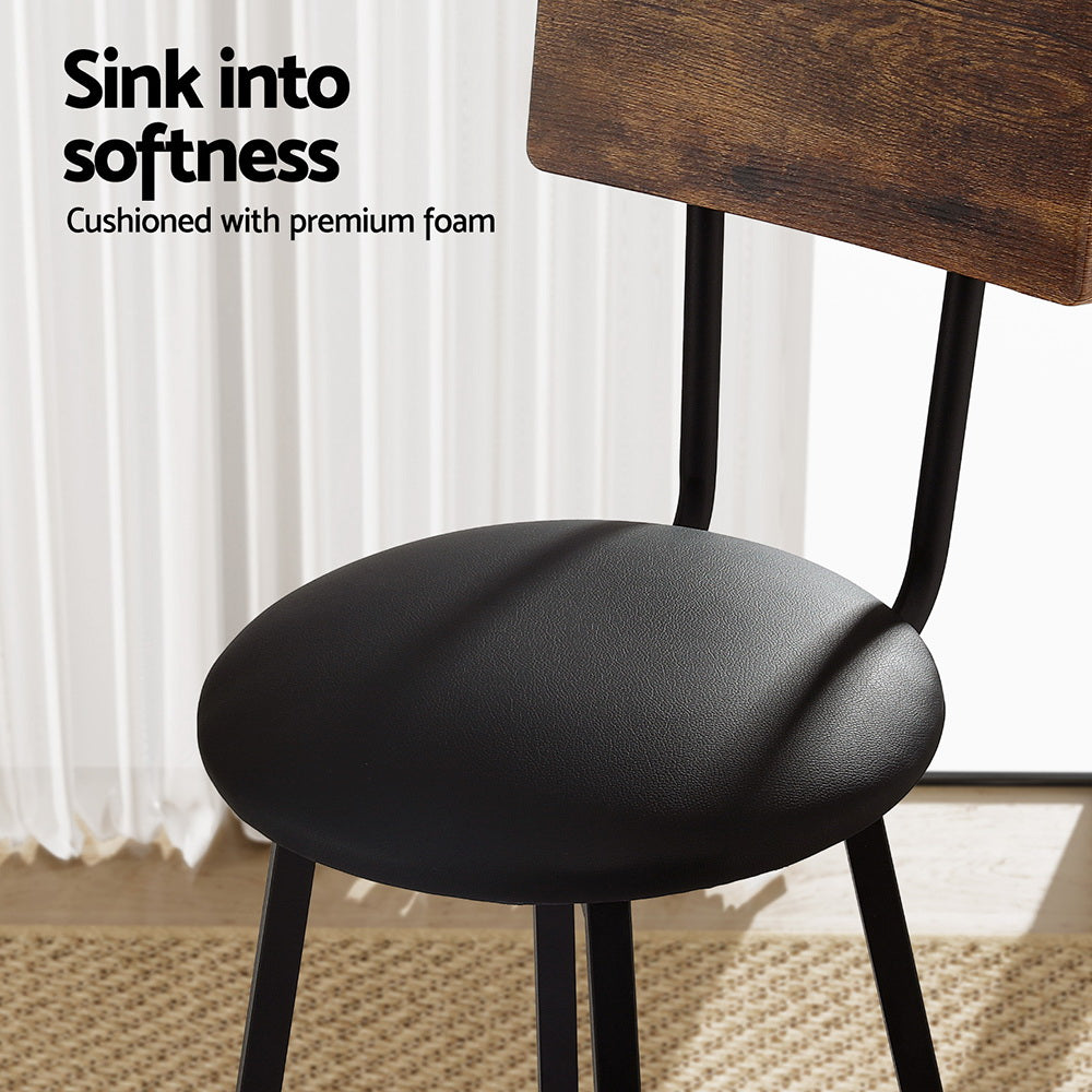 Industrial bar stool with black cushioned seat, brown wood backrest, and black steel legs