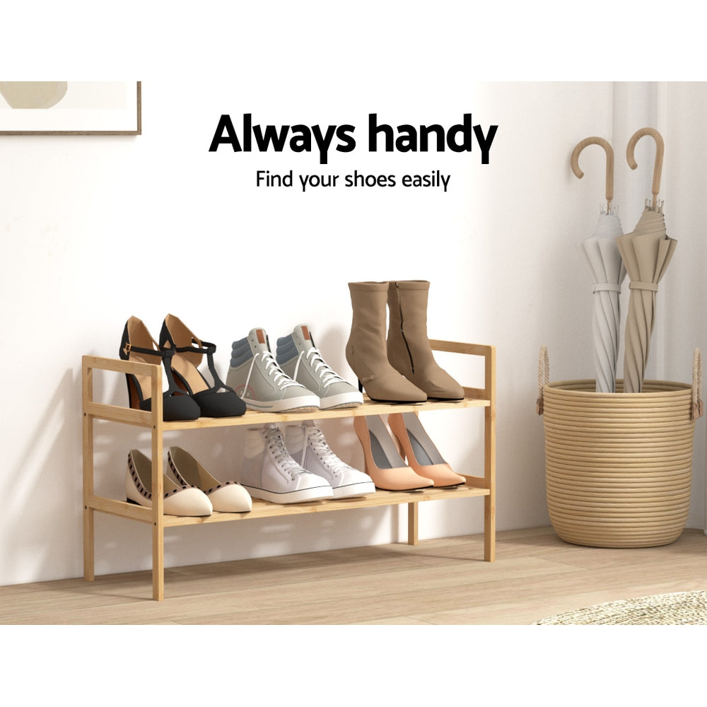 Bamboo shoe rack with two open shelves, multiple shoe pairs displayed on rails.