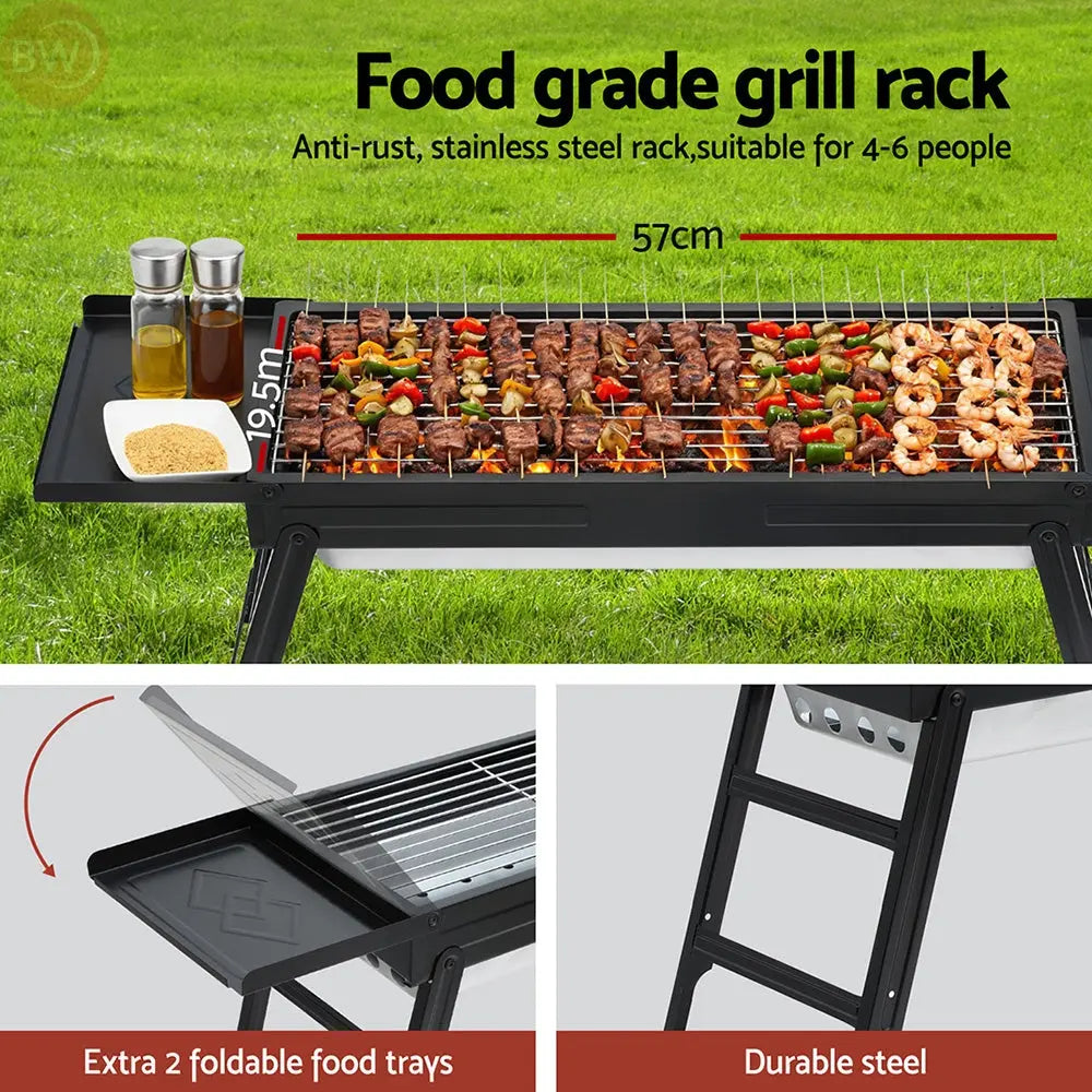 Outdoor charcoal grill with food on wire rack and stainless steel spice tray