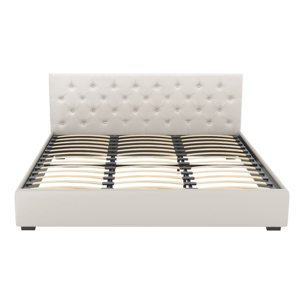 Beige king bed frame with tufted headboard, platform base, and slat support