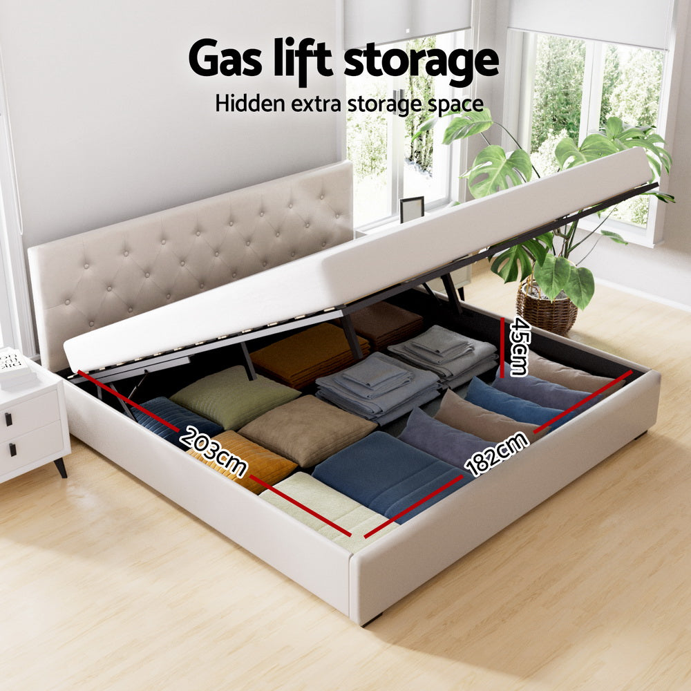 Beige king bed frame with lift-up storage compartment beneath the base