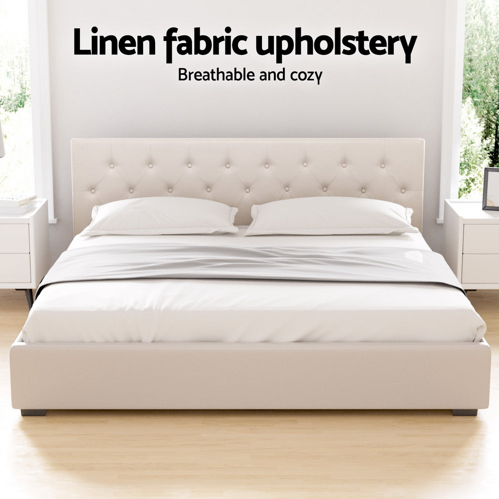 Beige king bed frame with linen-style upholstered headboard and padded side rails