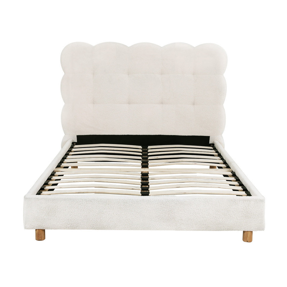 White cloud-style upholstered headboard and platform bed frame with slatted base