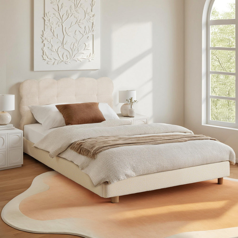 Cloud headboard bed frame with light boucle fabric and platform base, styled in white