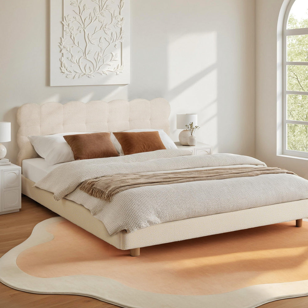 White boucle queen bed frame with scalloped cloud headboard and platform base