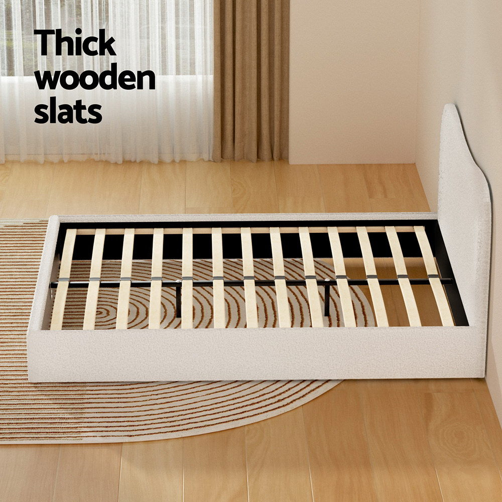 Queen bed frame with thick wooden slats and fabric skirt, black support legs