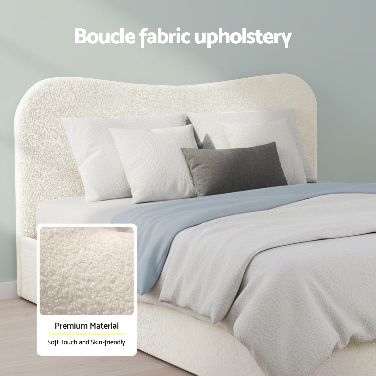 White boucle upholstered headboard and bed frame with pillows and blanket