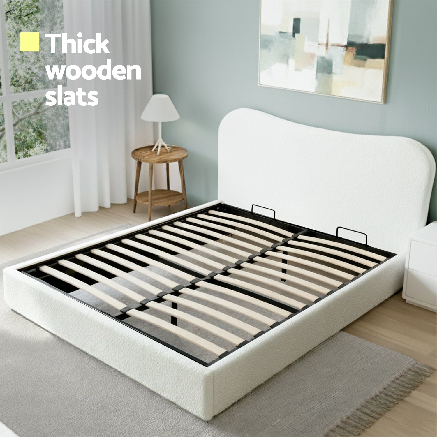 White queen bed with thick wooden slats and upholstered headboard, low platform