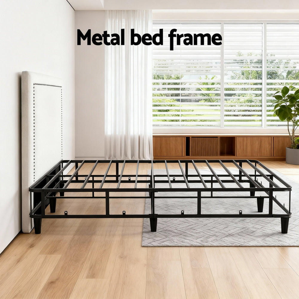 Queen bed frame with black metal slatted base and legs
