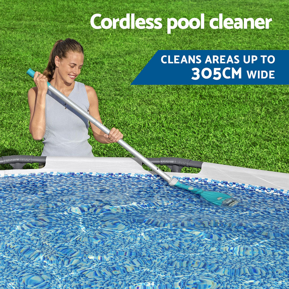 Cordless pool cleaner vacuum pole with teal handle held above a blue swimming pool