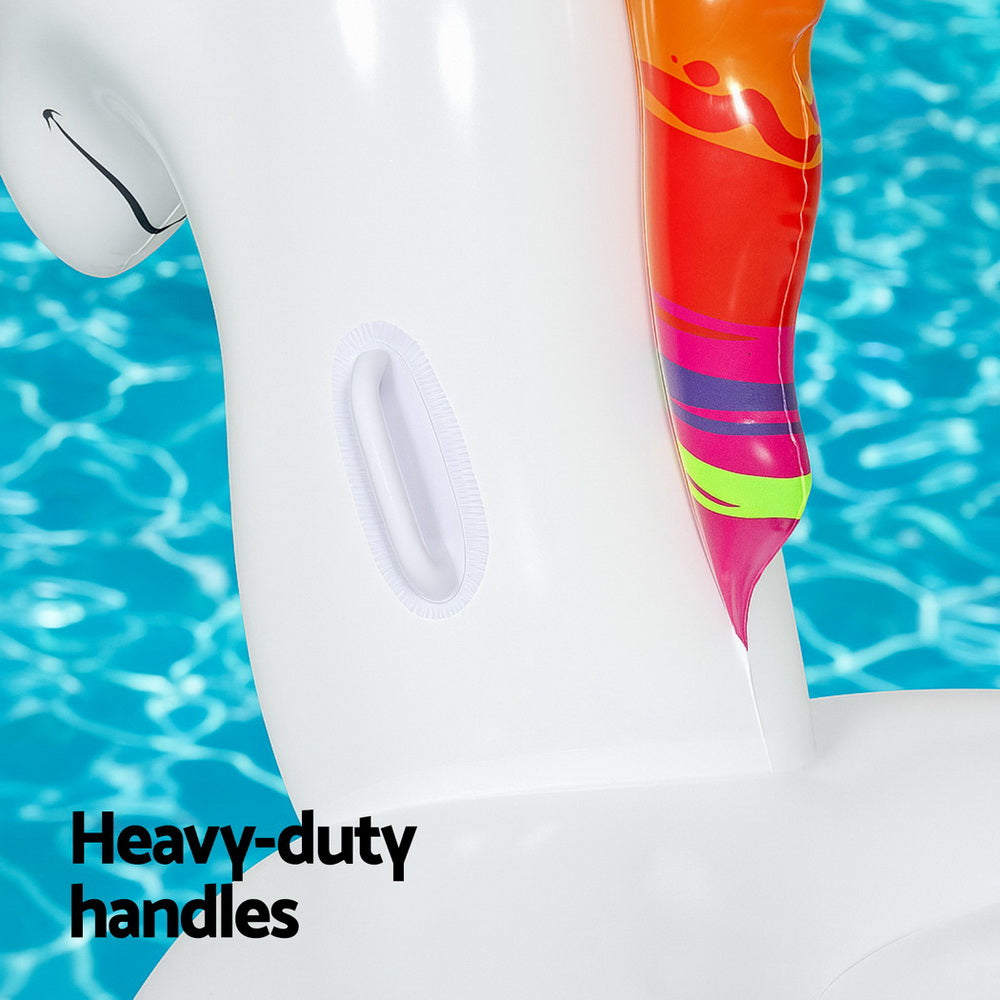 White unicorn inflatable pool float close-up with oval grip panel and rainbow side stripe