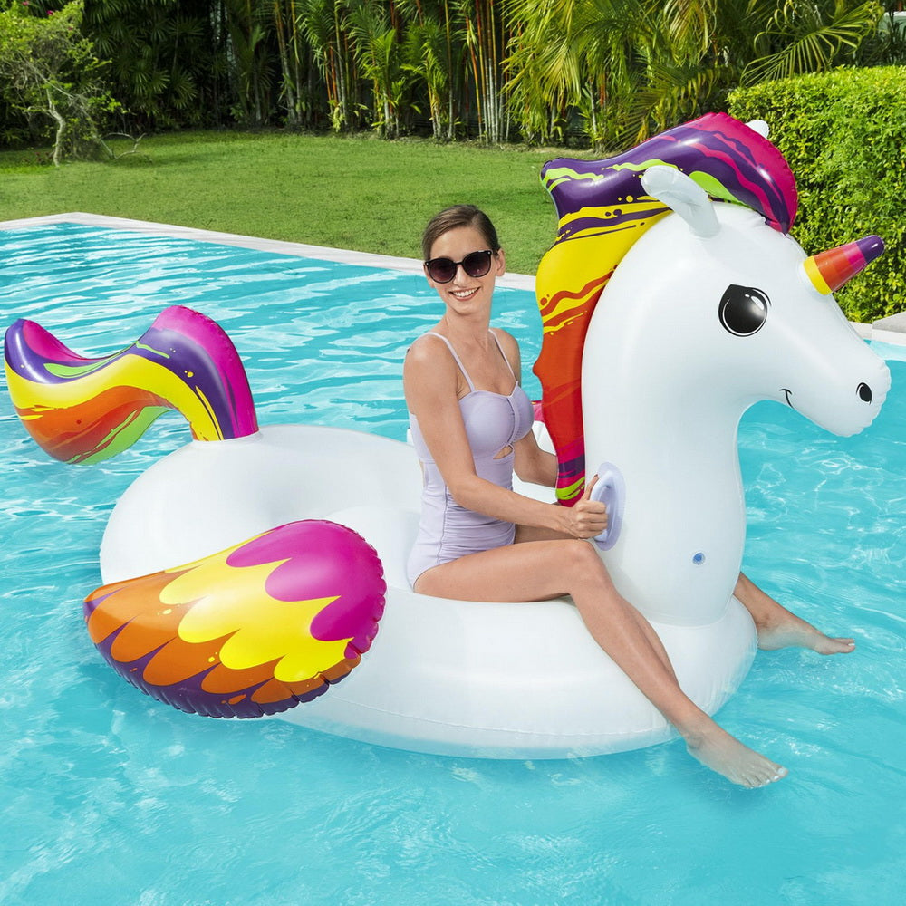 Unicorn inflatable pool float lounger in white with rainbow mane and wing-shaped floats