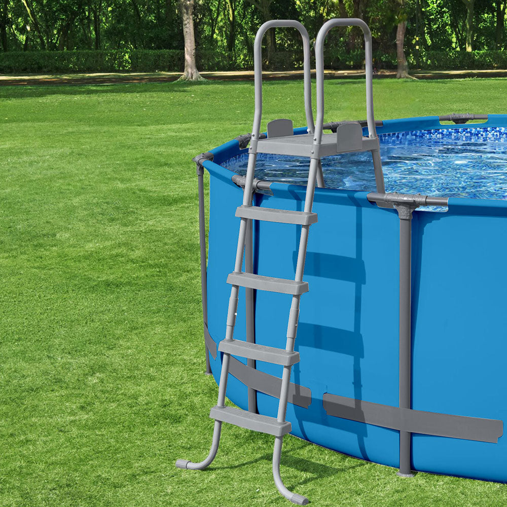 Above-ground pool ladder with removable steps next to a blue pool wall, light gray