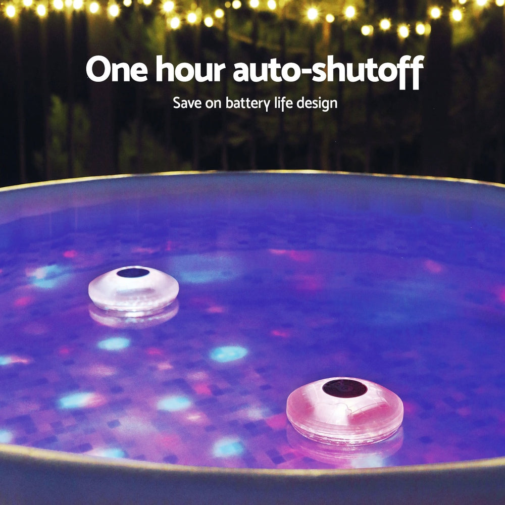 Floating LED pool lamp pair in water with bright purple light