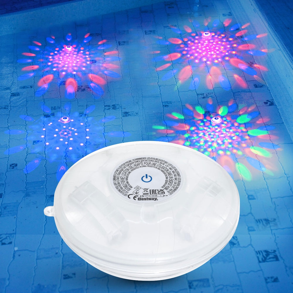 Floating LED pool lamp in pool water with multi-color light splash patterns