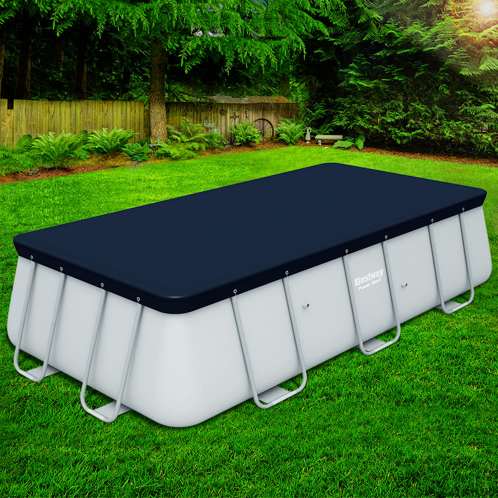 Above-ground pool with dark blue PVC cover fitted on top, side view