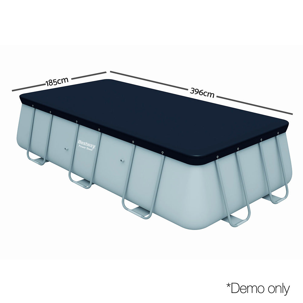 Above-ground pool with dark blue rectangular cover fitted on top, angled view