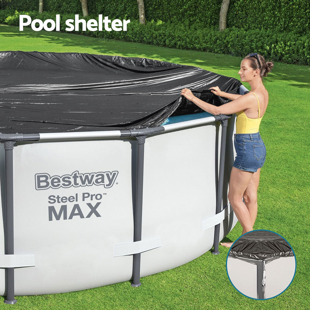 Round black pool cover sheltering an above-ground pool, with rope securing point