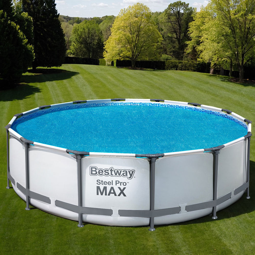 Round blue solar pool cover on above-ground pool, secured at the rim