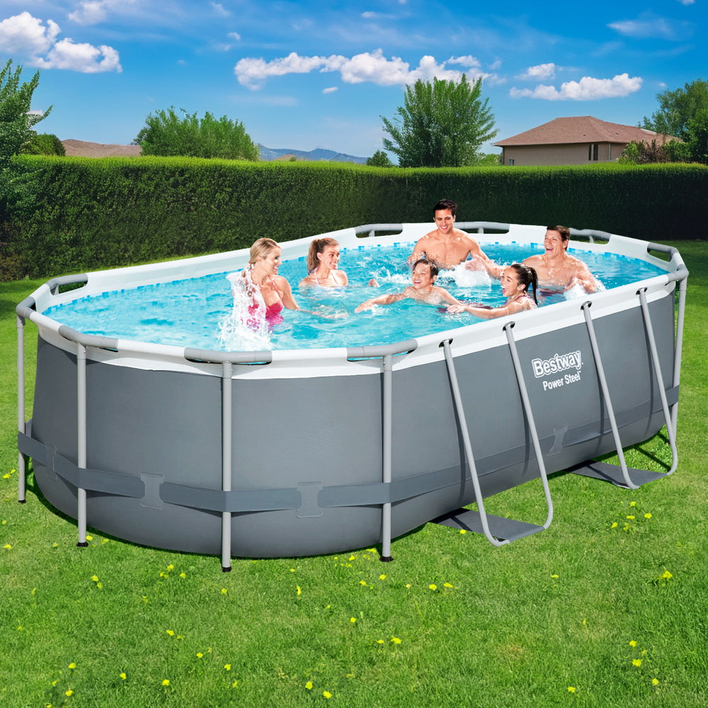 Above-ground swimming pool with gray steel frame and blue water on a lawn