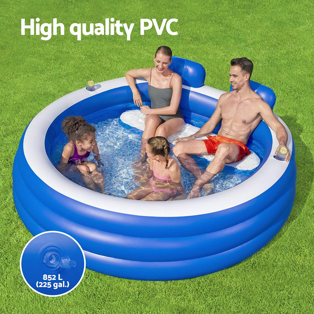 Inflatable kids pool with blue sidewalls, white rim, and raised headrests