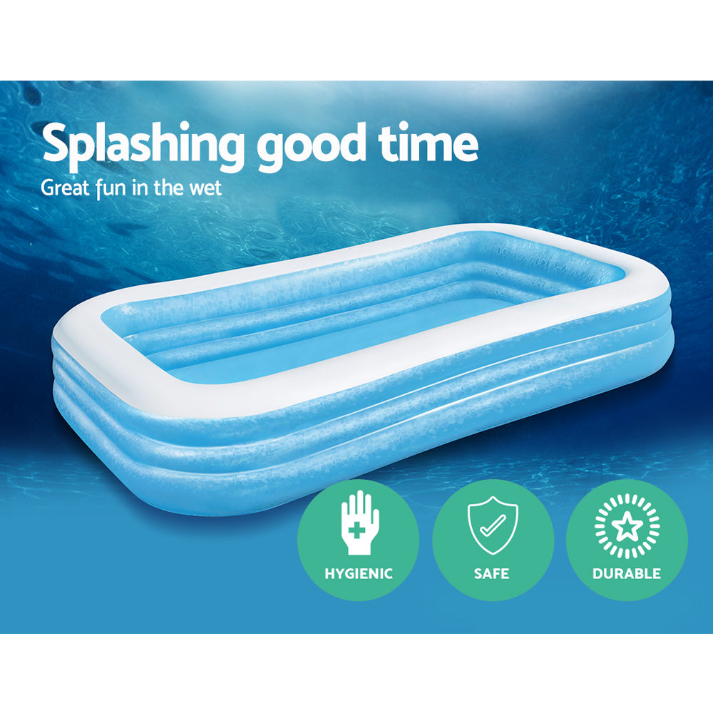 Inflatable rectangular kids pool with blue walls and white rim, filled with blue water