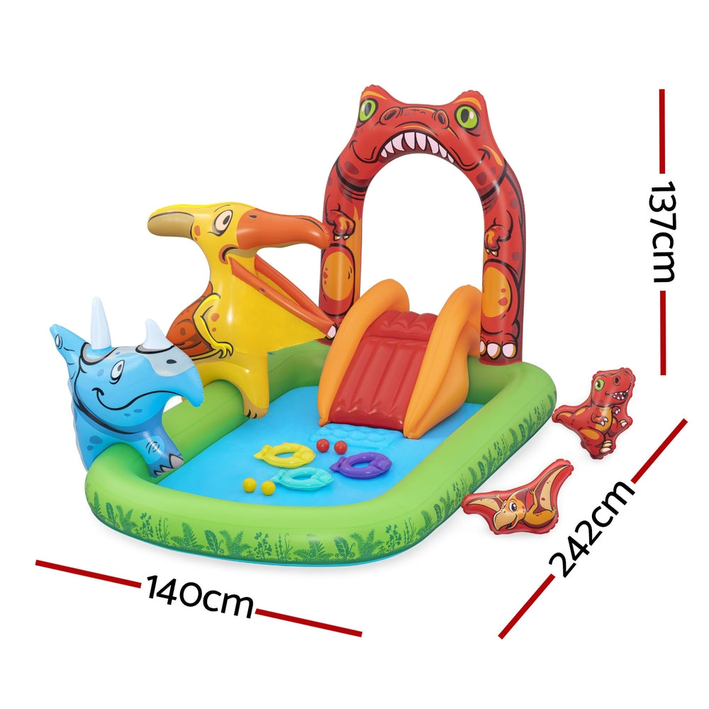 Kids inflatable splash pool with orange slide, red dinosaur arch, and toy ball tossing pieces