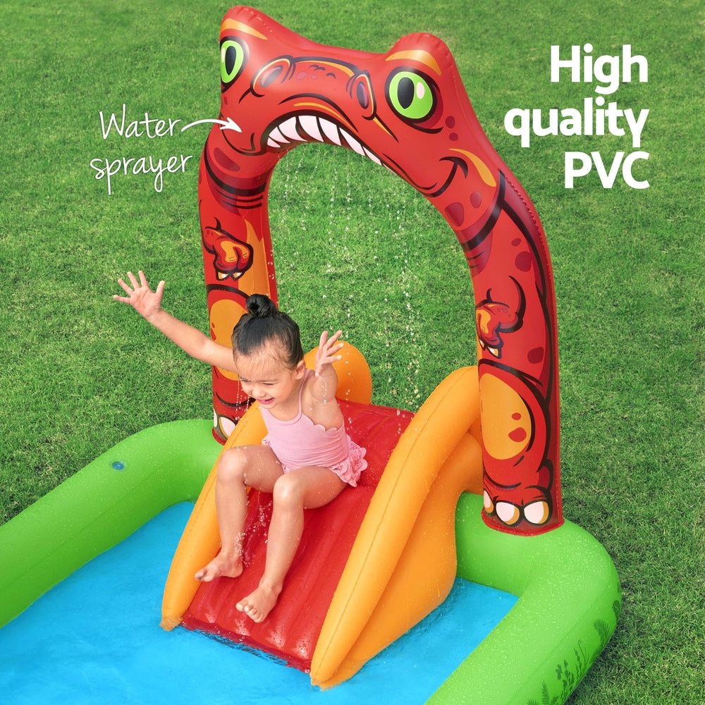 Kids inflatable splash pool with orange slide and red dinosaur arch, used outdoors
