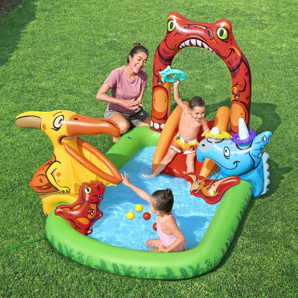 Kids inflatable splash pool with slide, red dinosaur arch, and animal splash towers