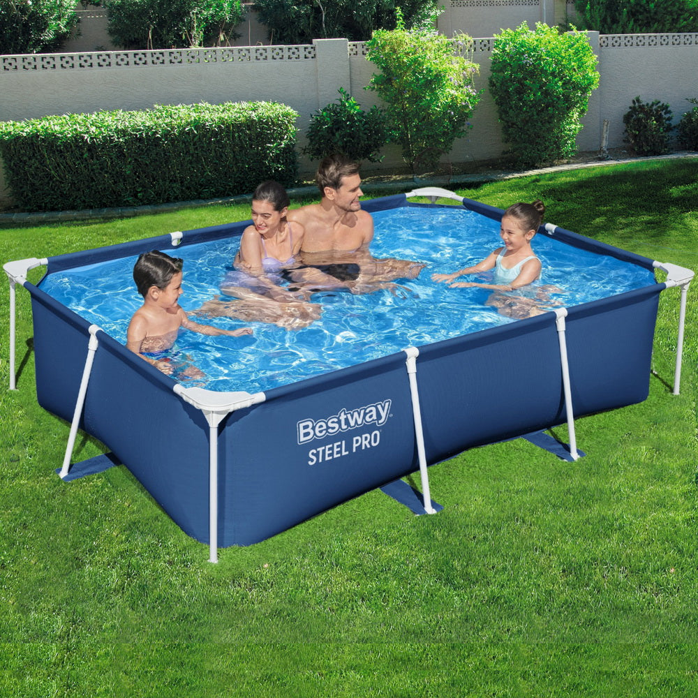 Above-ground swimming pool with dark blue sides, white frame, and swimmers in backyard