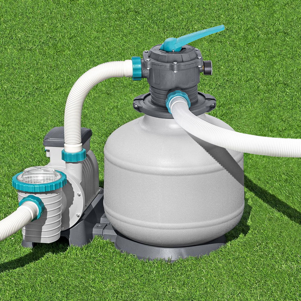 Pool sand filter pump with gray tank, teal valve top, and white hoses
