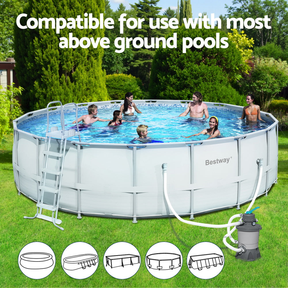 Above-ground pool with attached sand filter pump and connected hoses